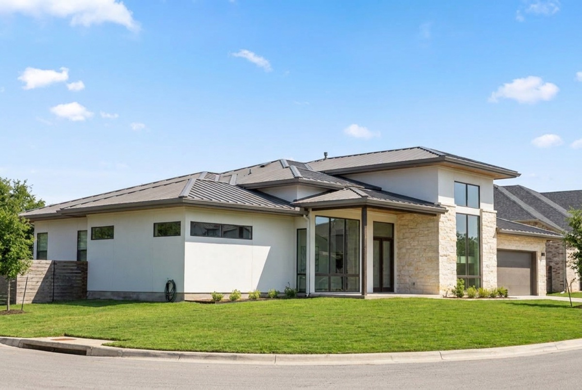 The same modern Austin home in clear daylight, before lighting