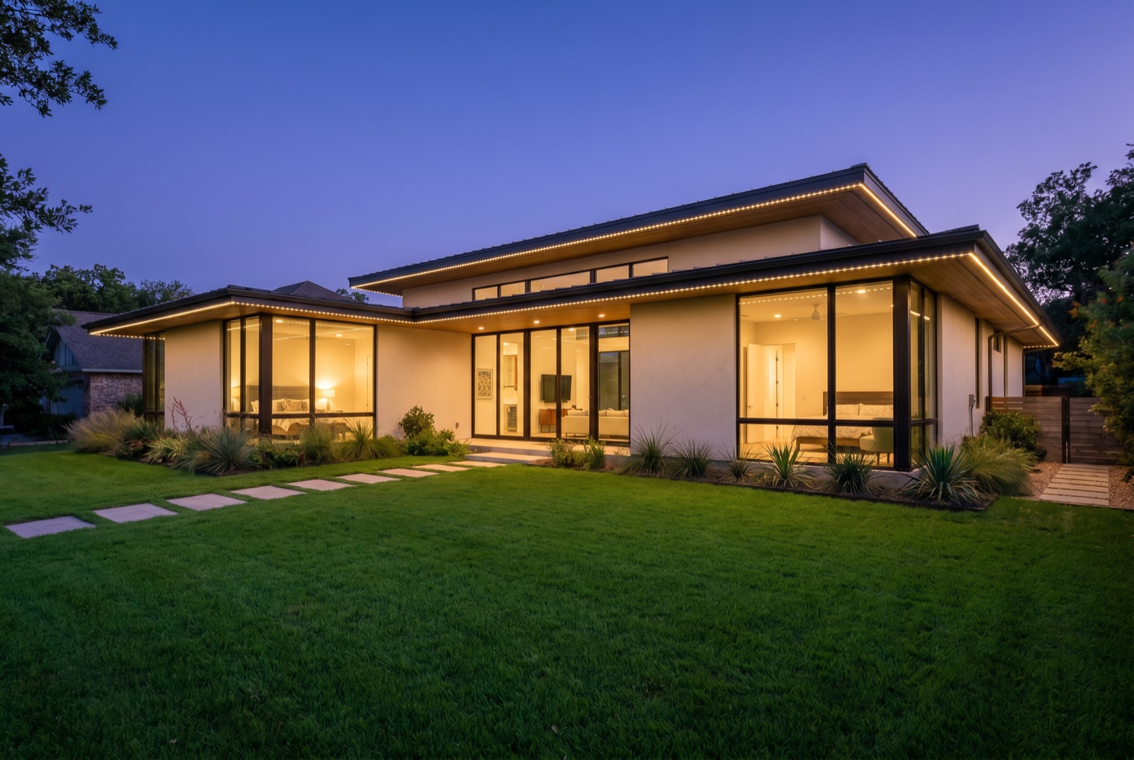 Modern Austin home with clean warm-white permanent LED roofline