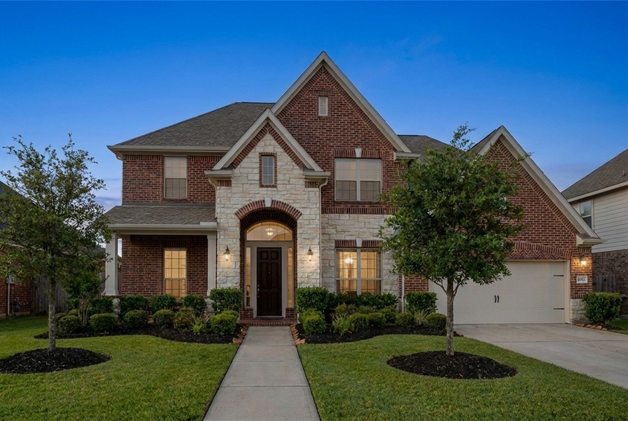 The sample home at dusk